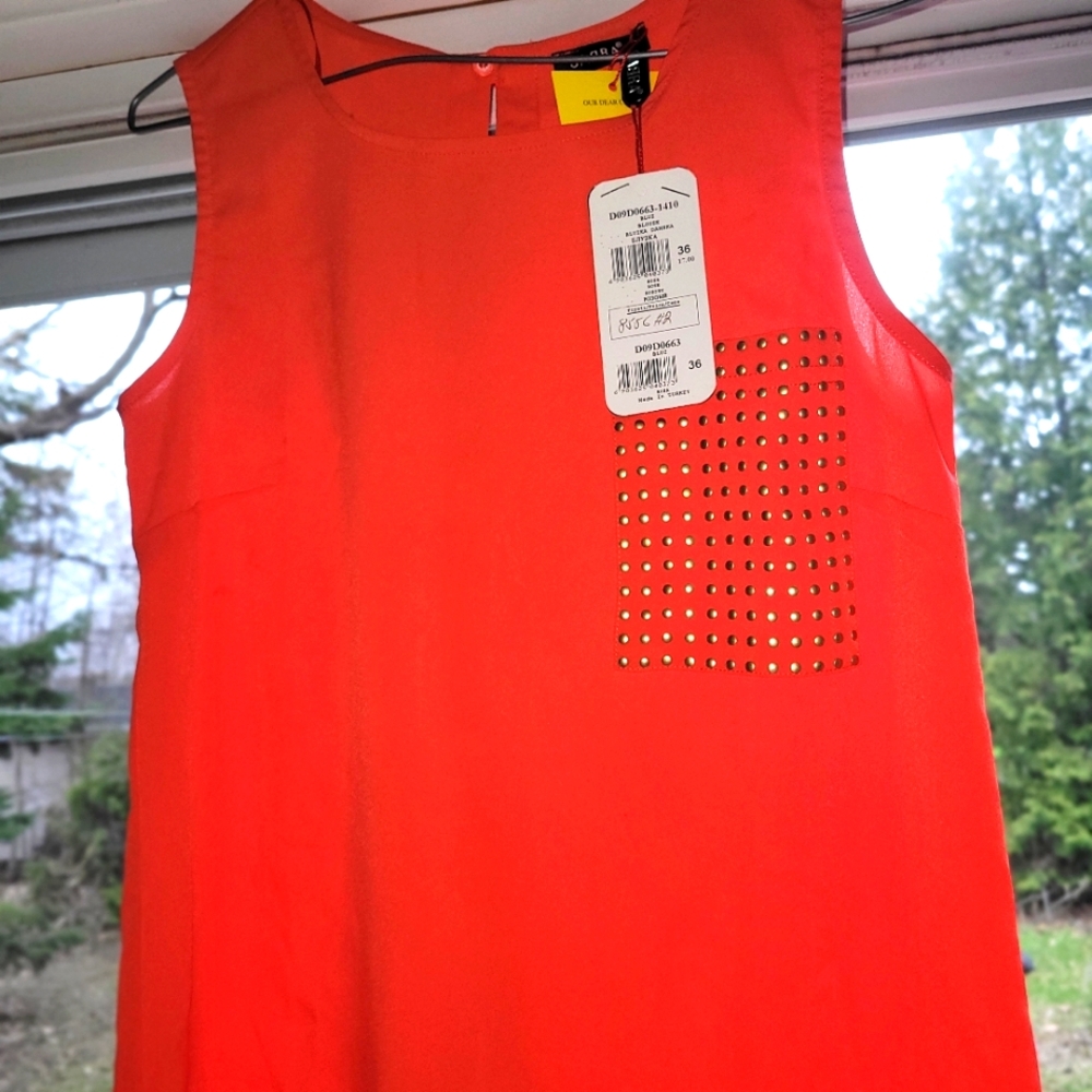 Orange Sleeveless Top with Studded Pocket.